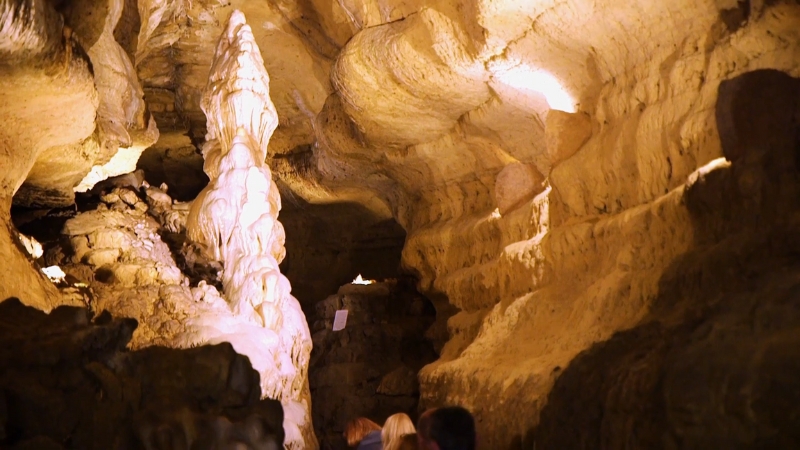 Visitors Exploring the Illuminated Cave of The Mounds, with Stunning Stalactites and Stalagmites