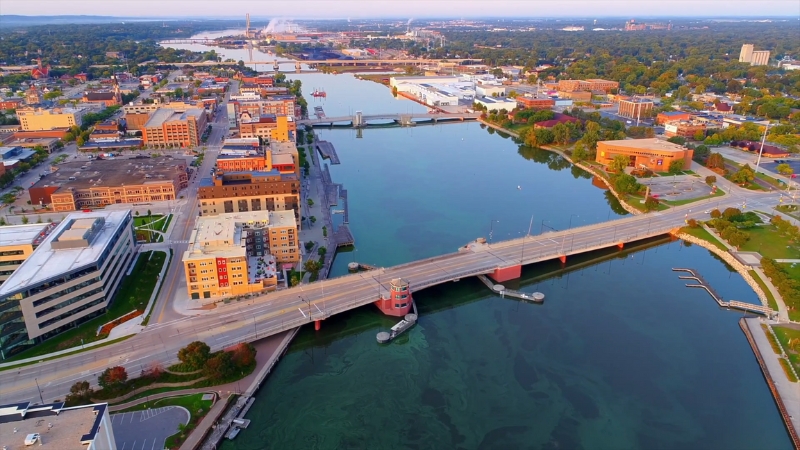 An Aerial View of Green Bay in Wisconsin, Featuring the Waterfront, Bridge, and Cityscape