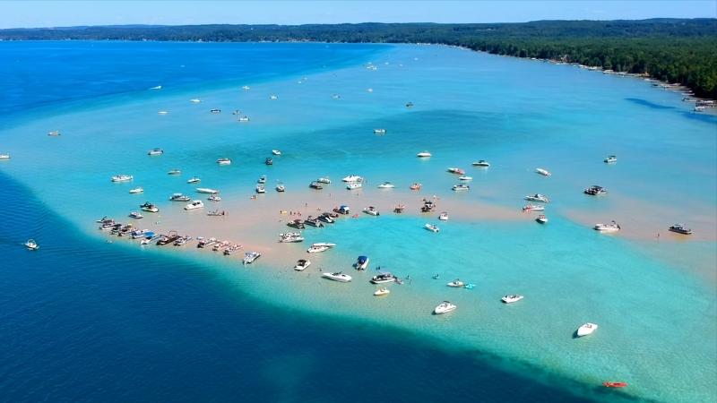 Boats Scattered on The Clear Waters of Torch Lake